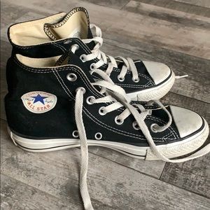 Women’s black Converse high tops